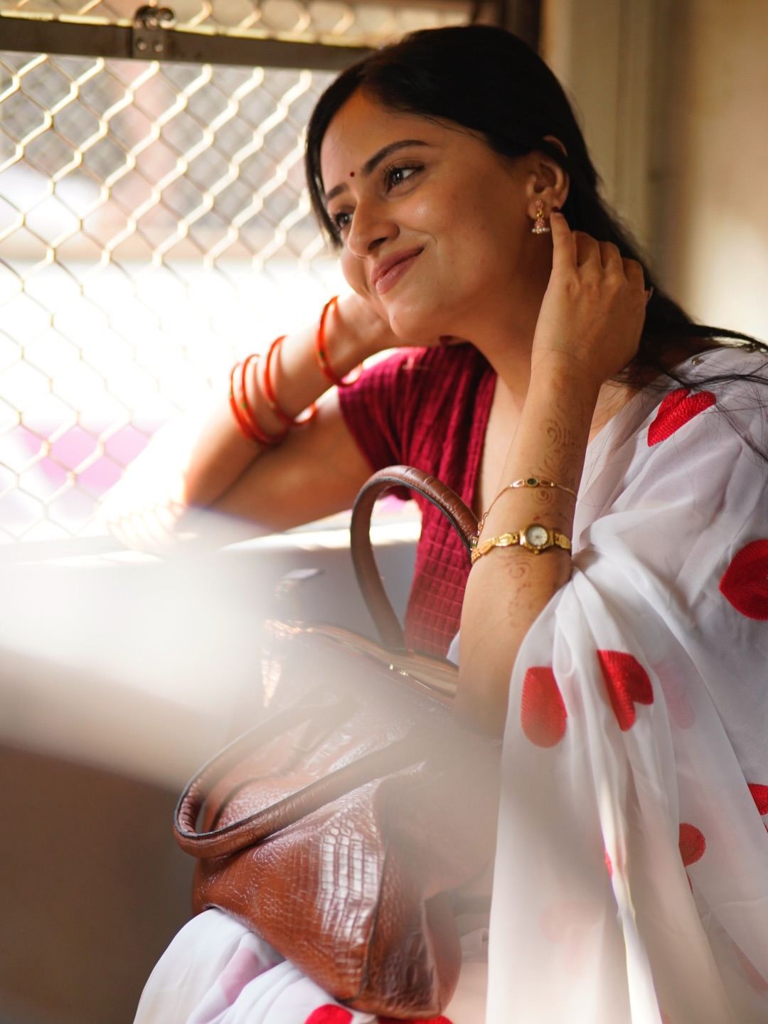 Sanya Thakurrr Striking A Playful Hand Rail Pose
