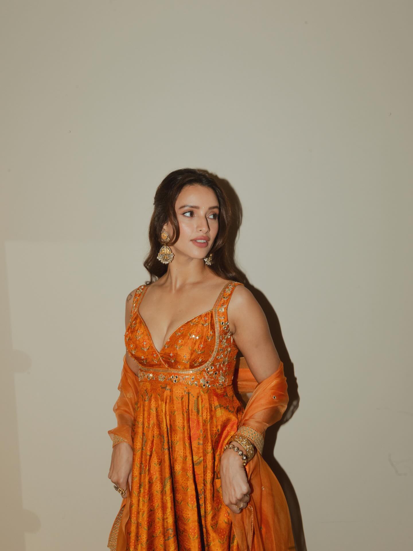 Triptii Dimri Posing In A Royal Orange Anarkali.