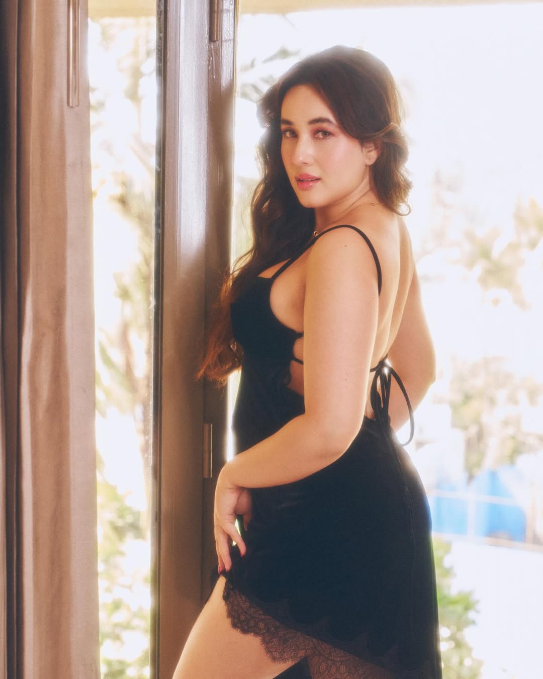Aditi Budhathoki Posing In Black Silk Nightwear