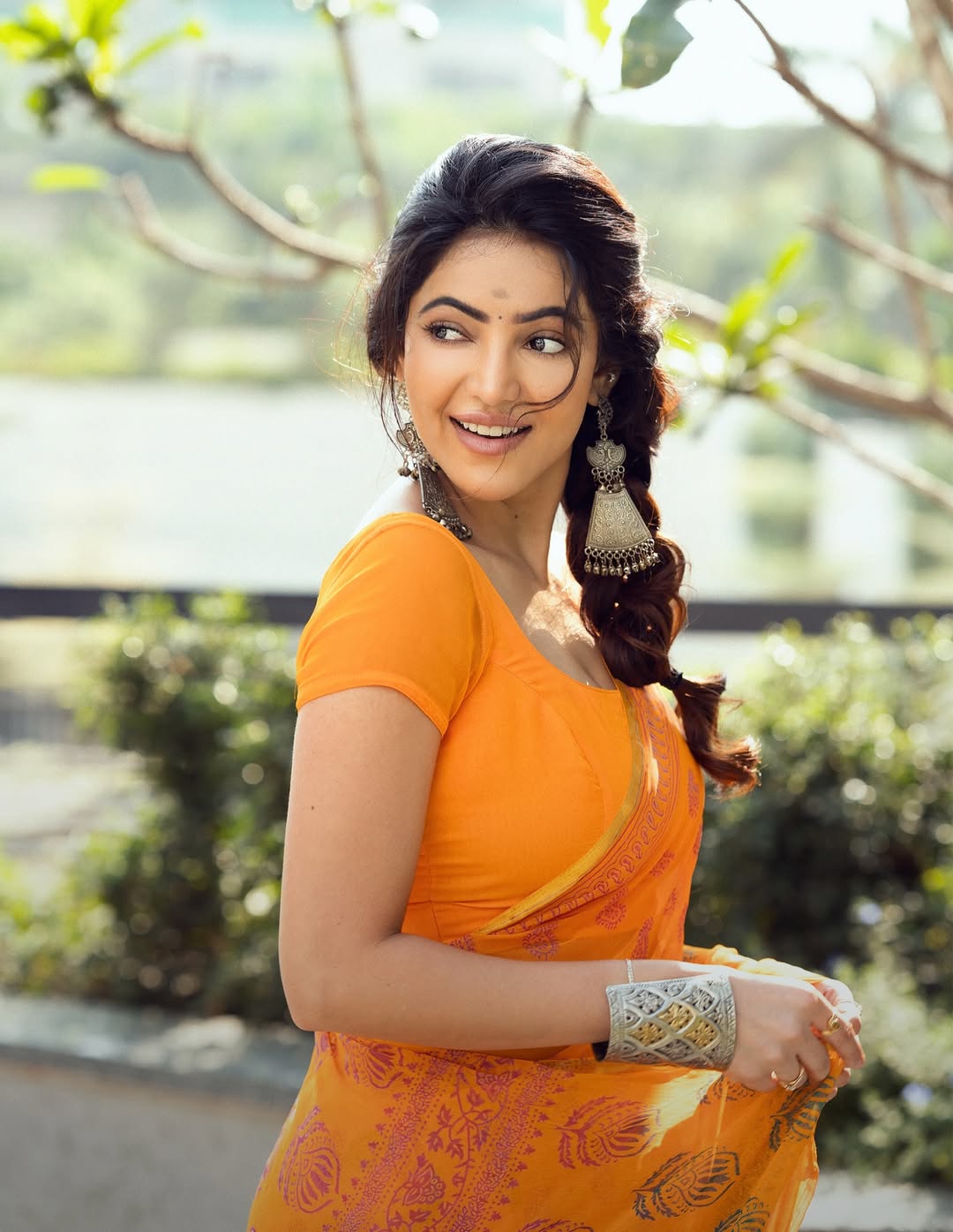 Athulyaa Ravi Smiling In A Vibrant Orange Saree