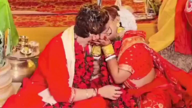 Newlywed Couple Kiss At Wedding Mandap