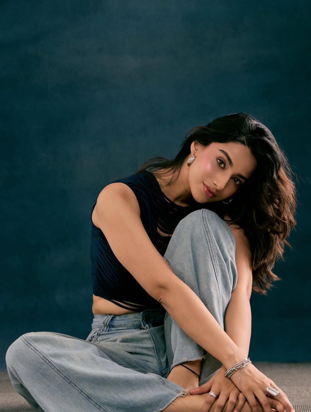Meenaakshi Chaudhary Sitting Cross Legged Style