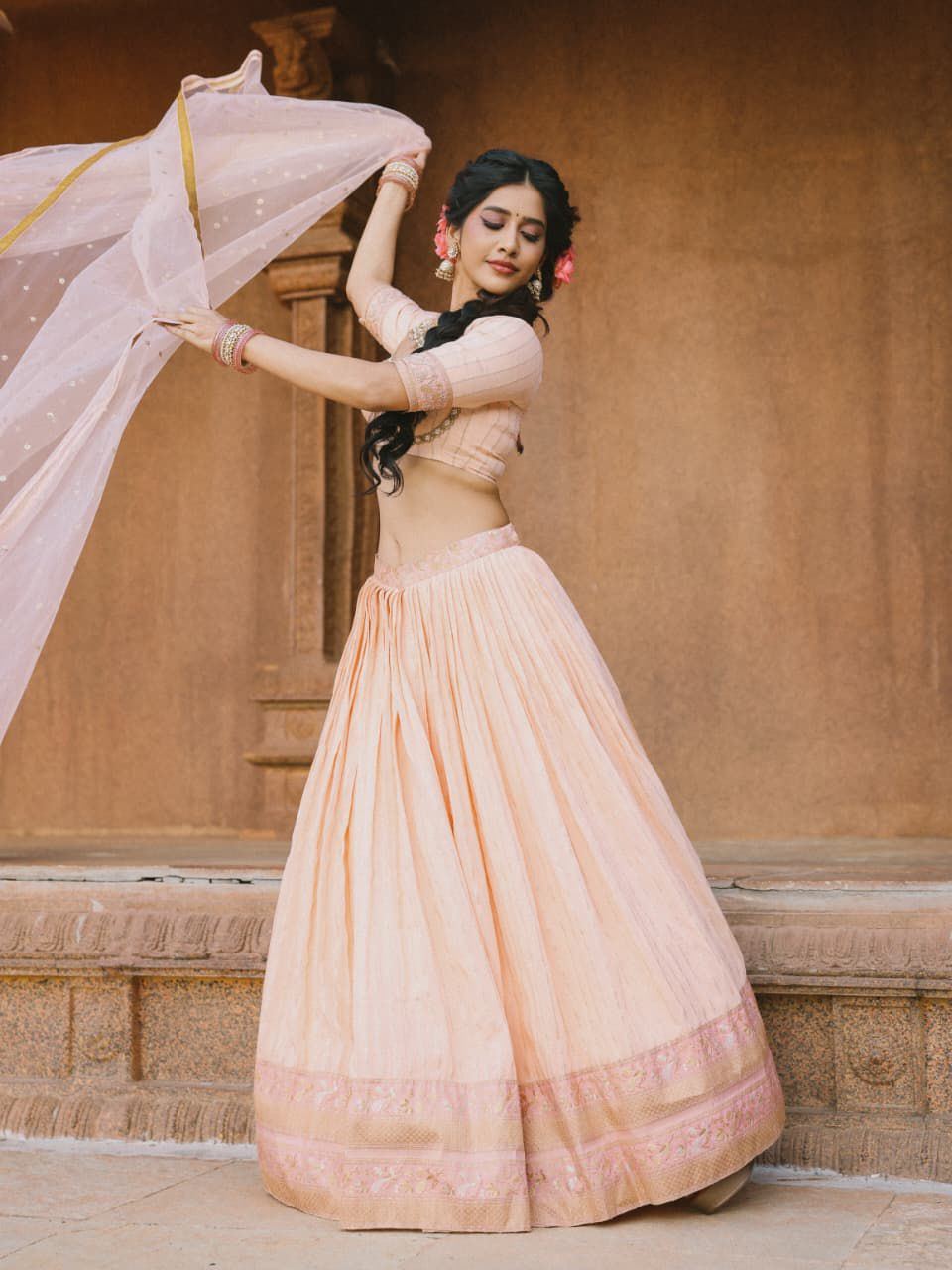 Nabha Natesh In Peach Lehenga With Braided Hair