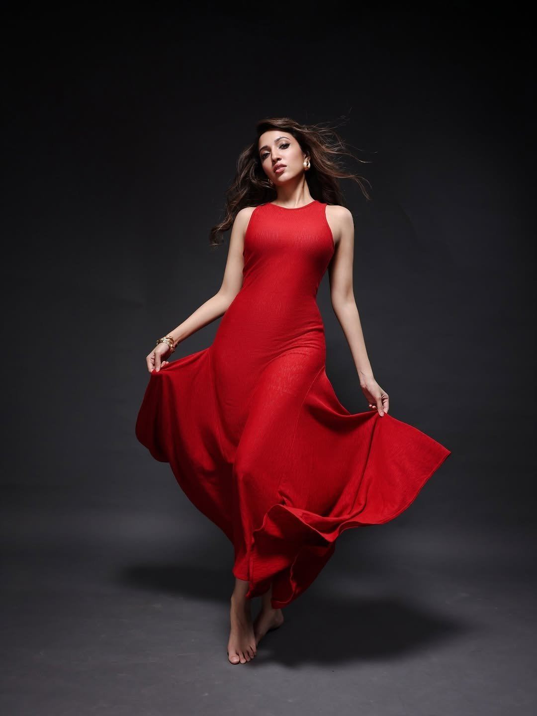 Stylish Neha Sshetty Twirling In Red Silk Gown