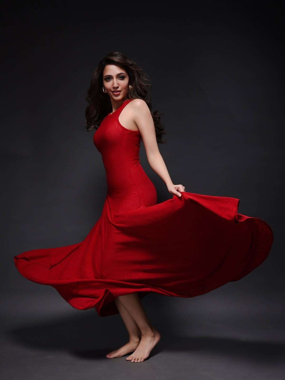 Neha Sshetty Posing Boldly In A Crimson Gown