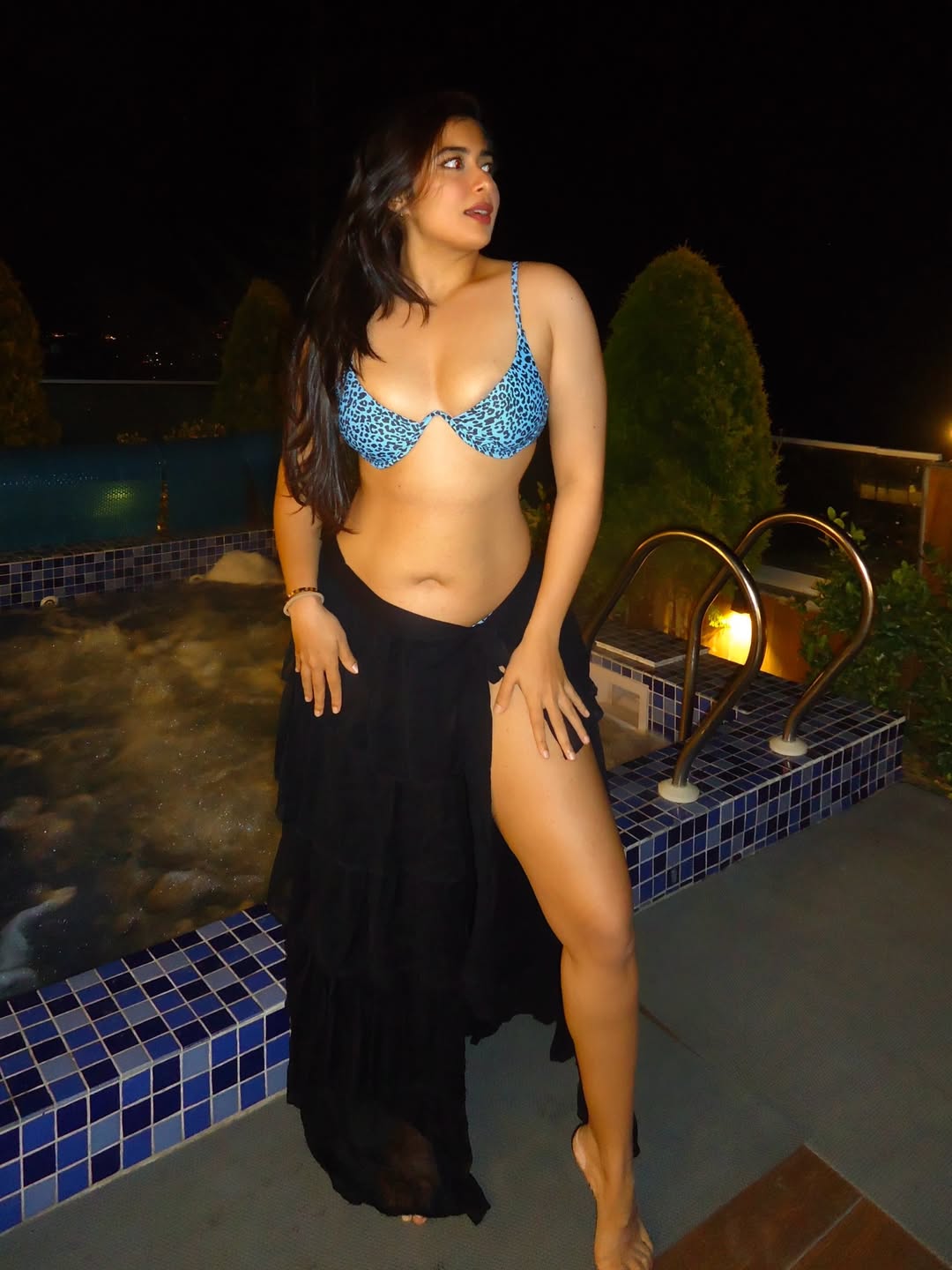 Nikita Sharma Posing Boldly By A Night Poolside