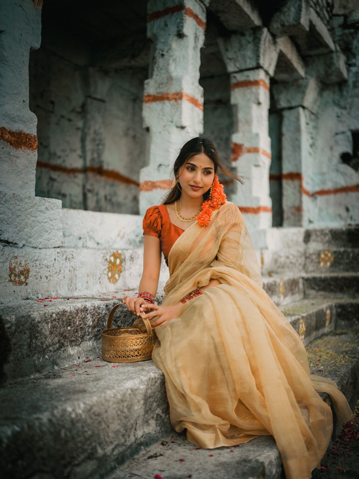 Pranavi In Beige Saree Sitting On Stone Steps