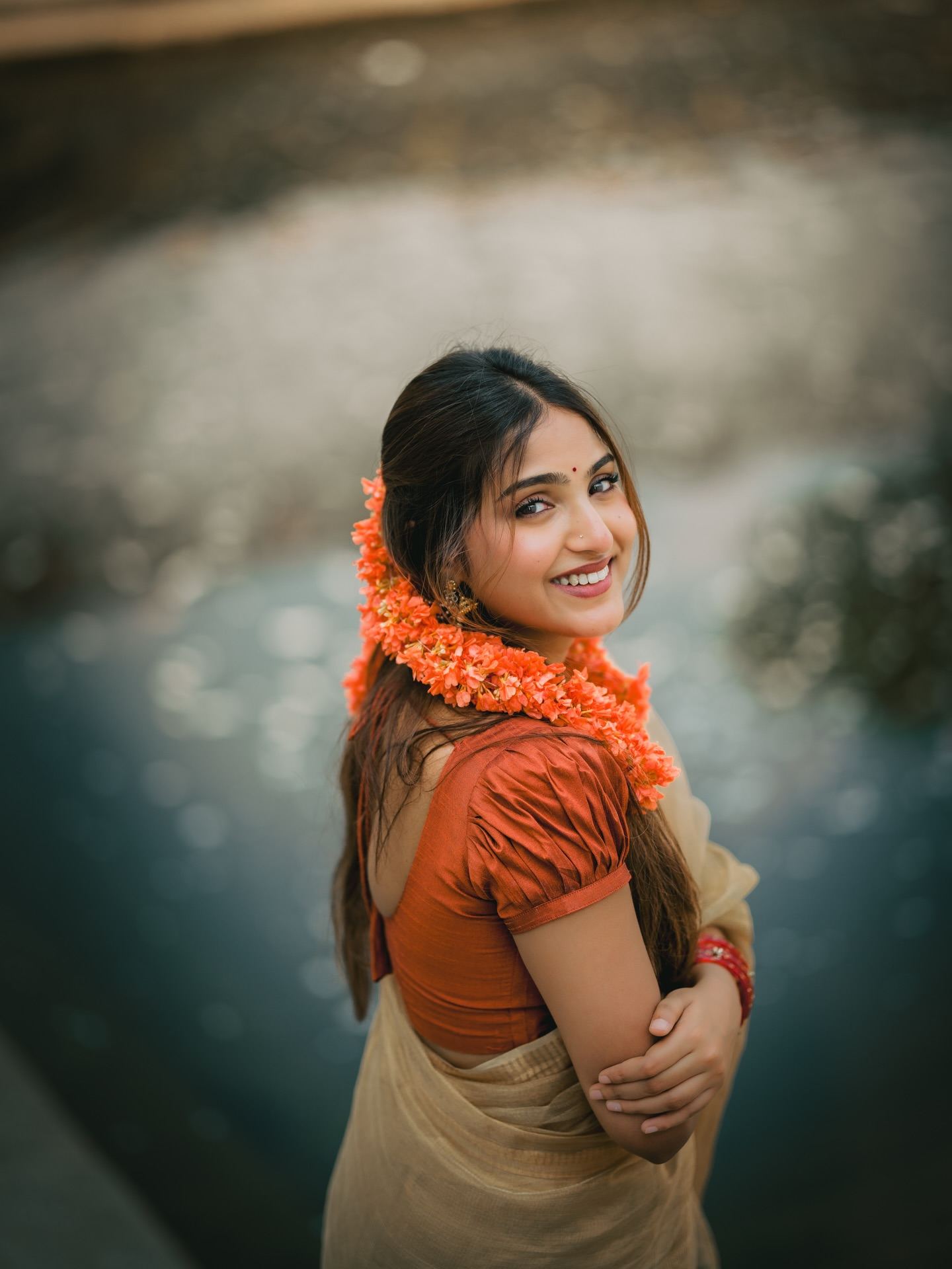 Floral Hair Style Adding Charm To Saree Outfit