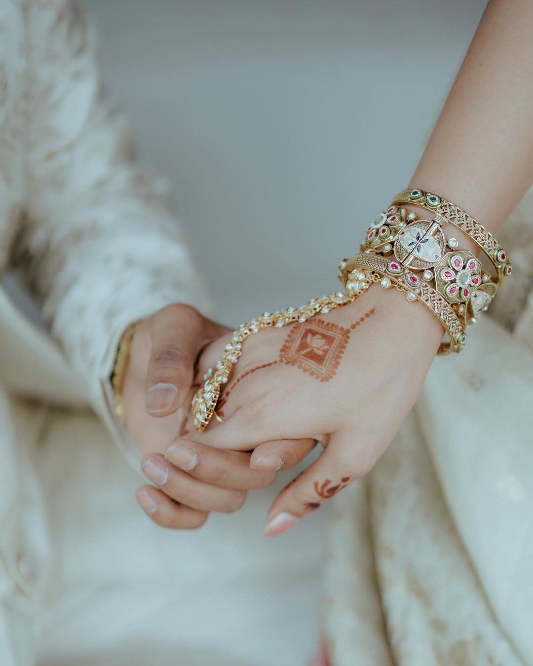 Couple Holding Hands During Engagement Moment