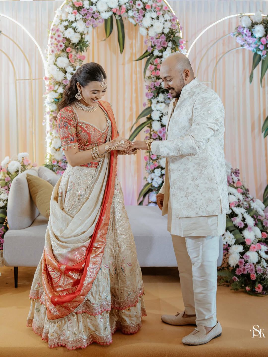 Couple Holding Hands During Engagement Moment