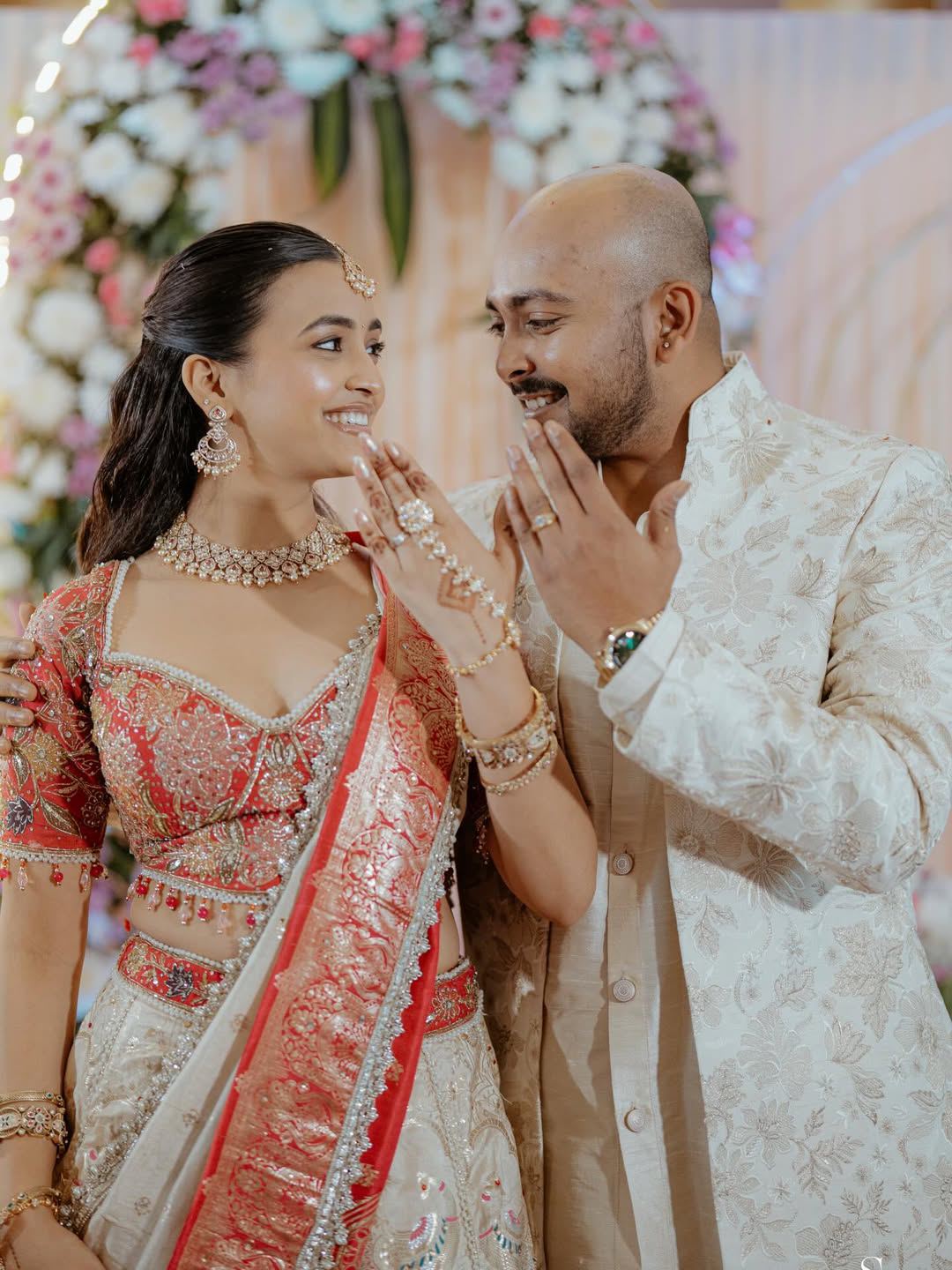 Engagement Ring Moment With Floral Backdrop