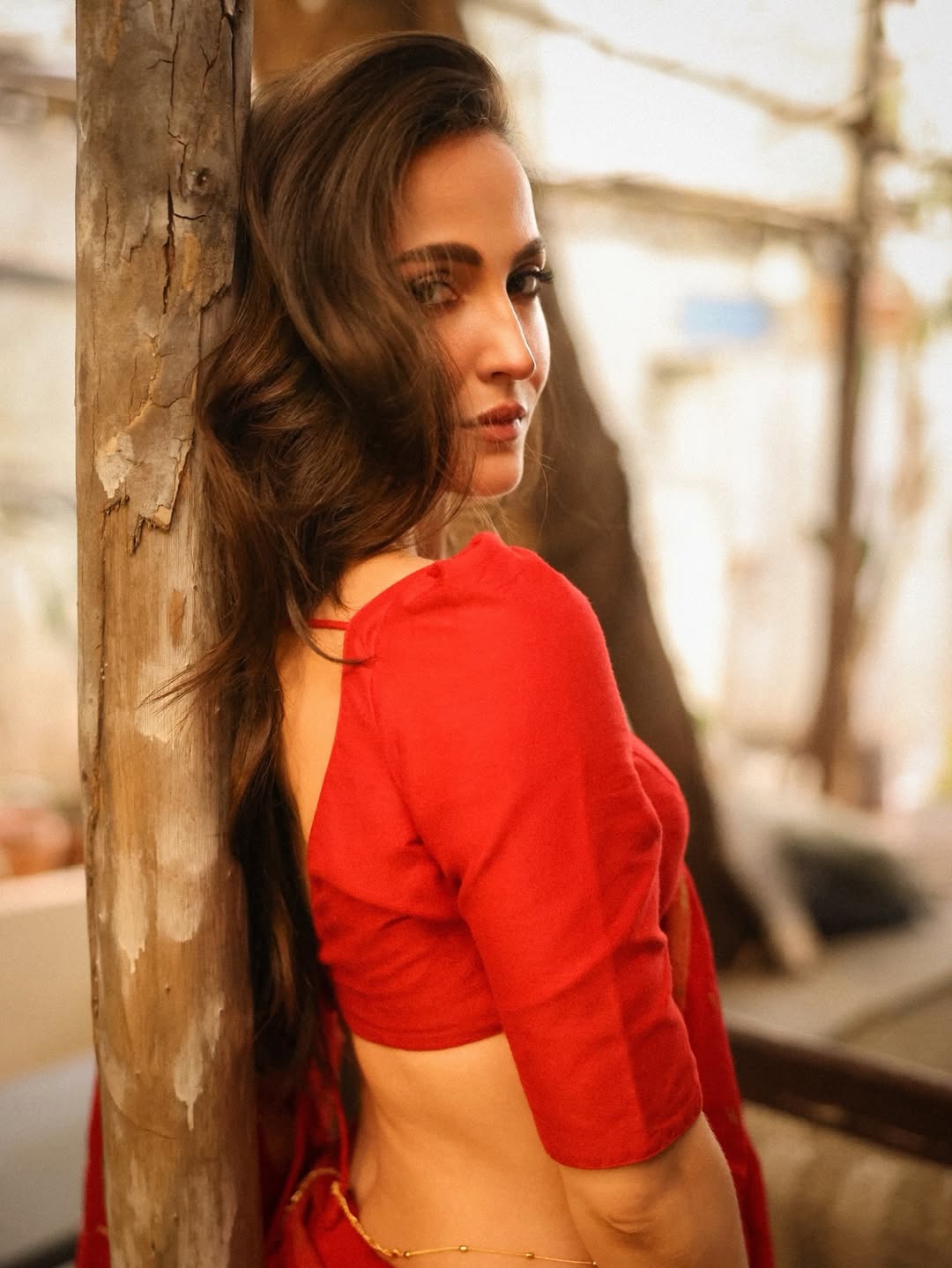 Elli AvrRam Radiates Confidence In Crimson Drape