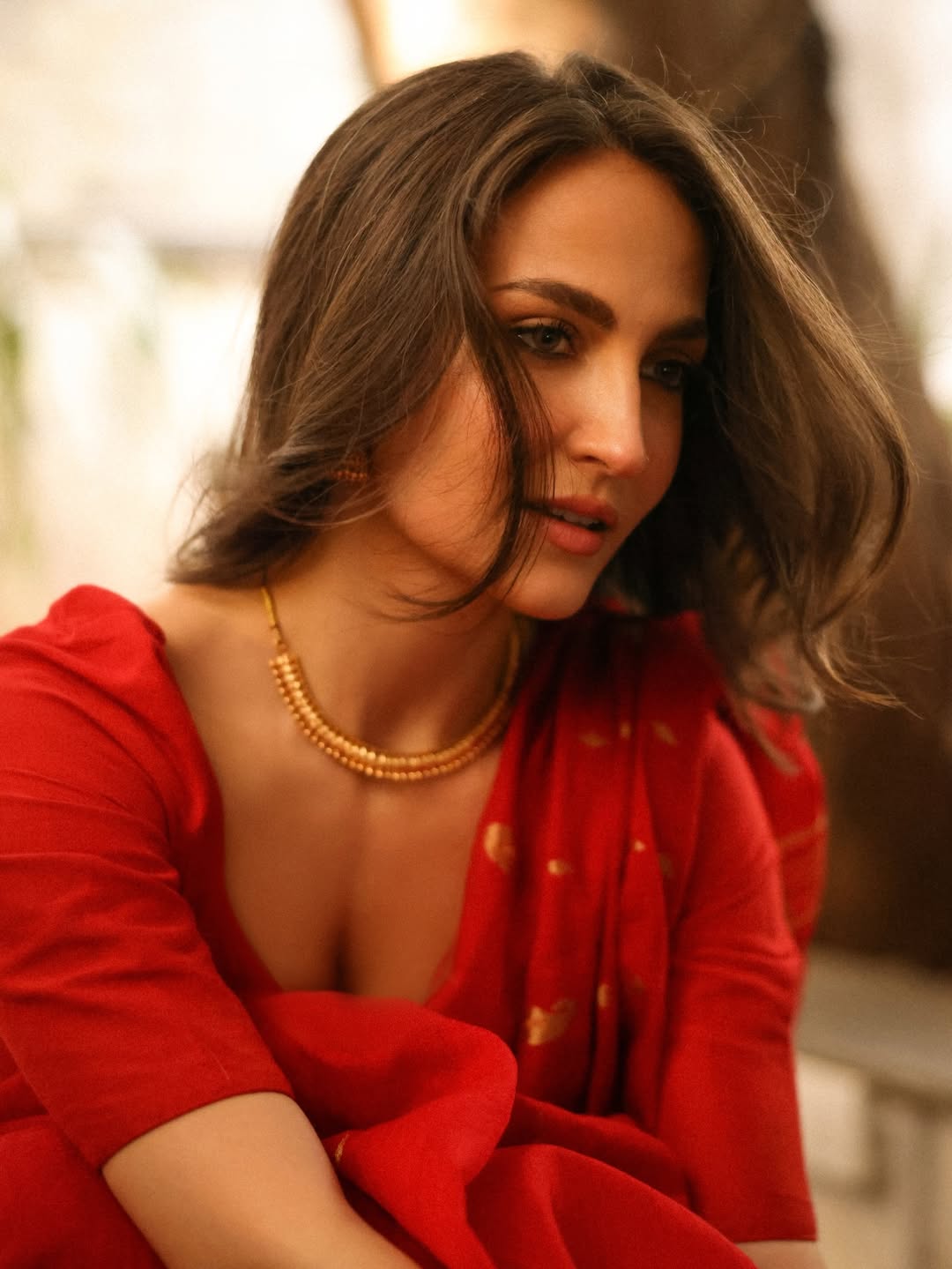 Elli AvrRam Poses Boldly In Vibrant Red Saree