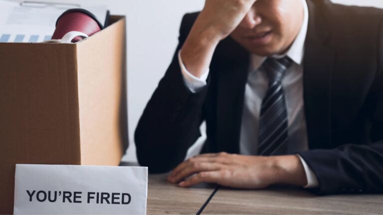 IT job layoffs crisis showing stressed employees and job insecurity in tech sector