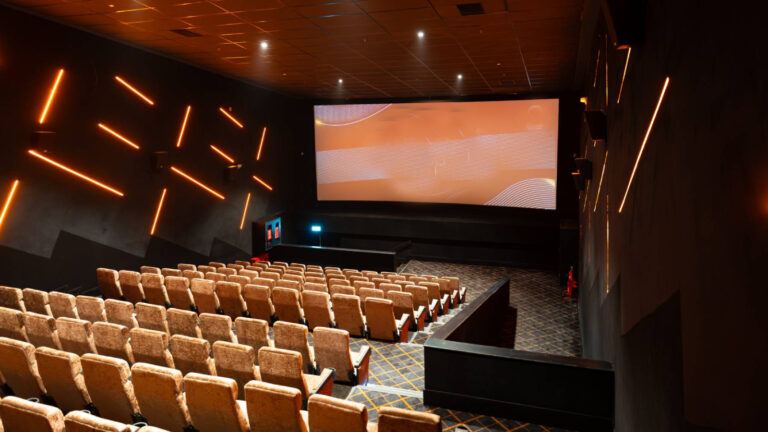 Single screen cinema theatre in India highlighting rental vs percentage dispute in Tollywood