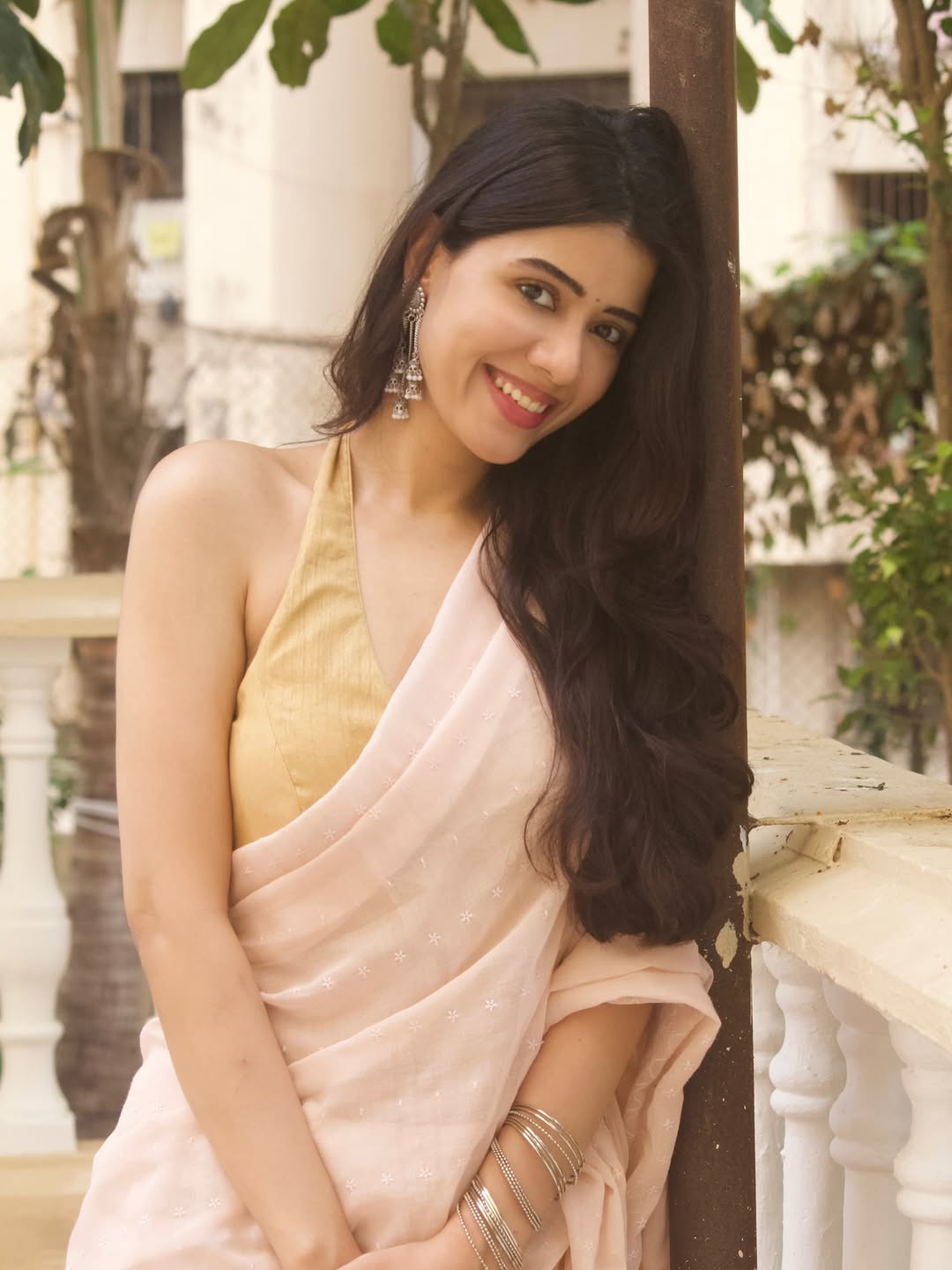 Aarti Chikara Flaunting Elegant Golden Halter Neck