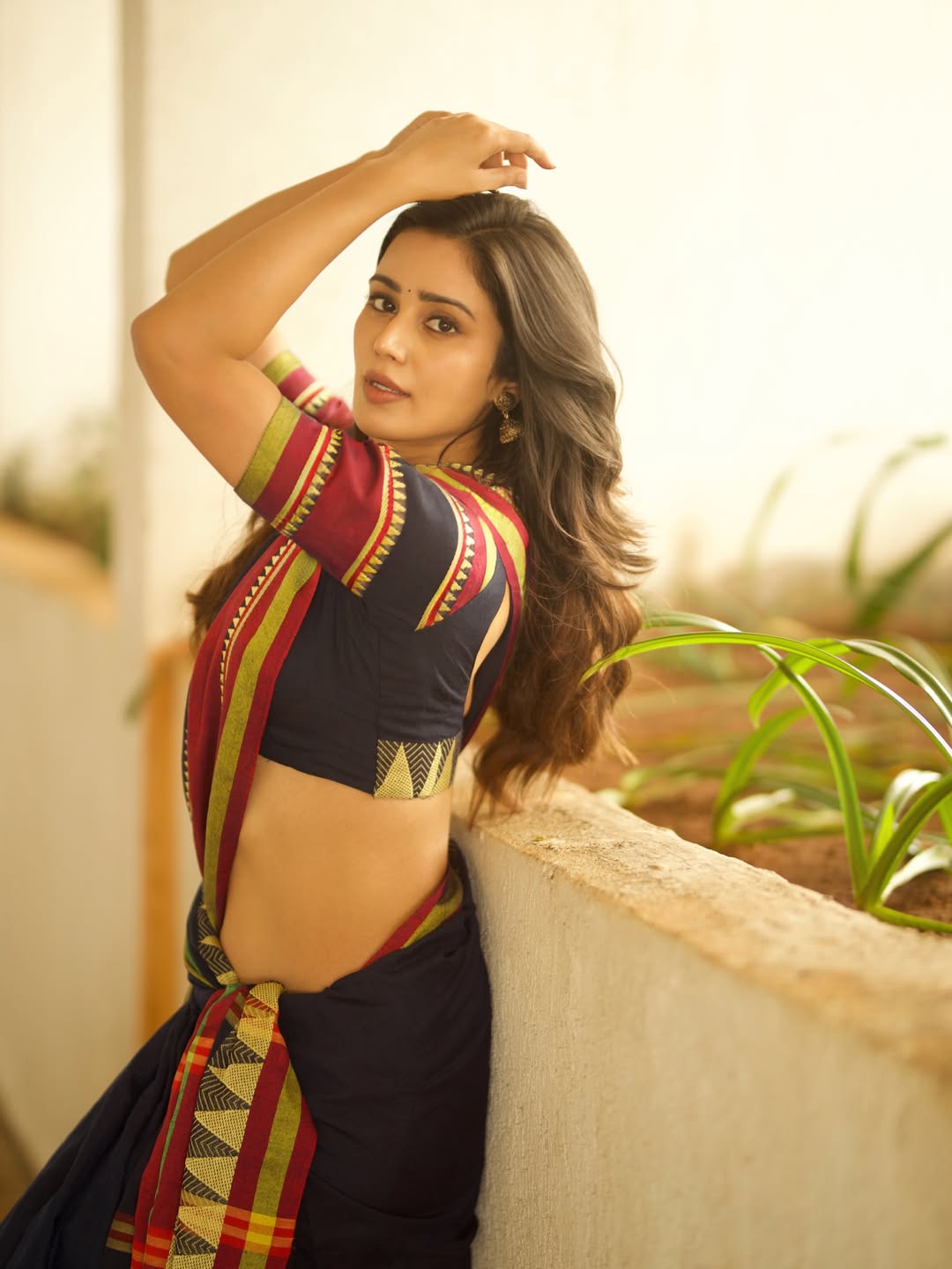 Anaira Gupta Standing Gracefully Near Planter Box