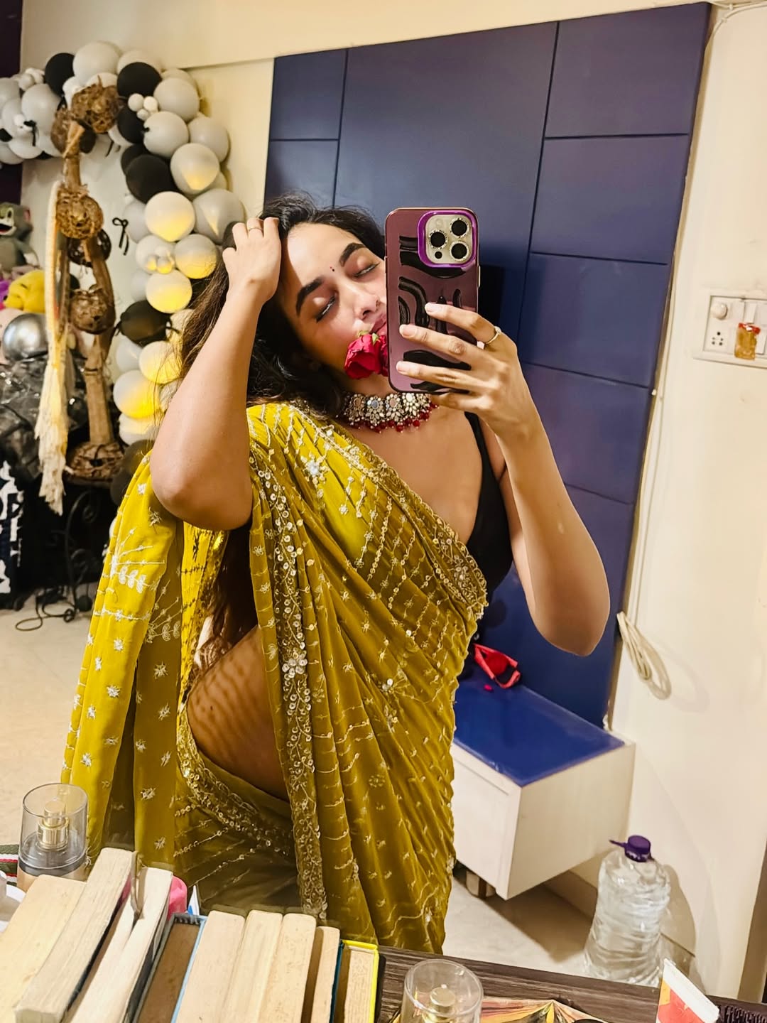 Aparna Reddy Holding Red Rose Petal In Mirror Pose