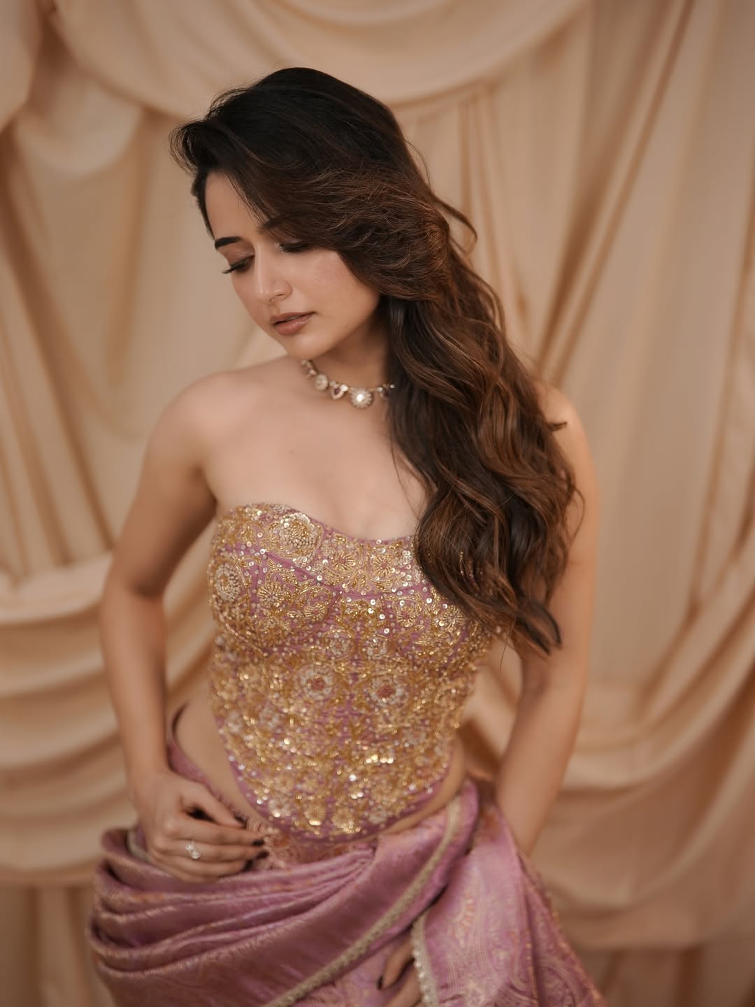 Ashika Ranganath Looking Down Thoughtfully In Saree