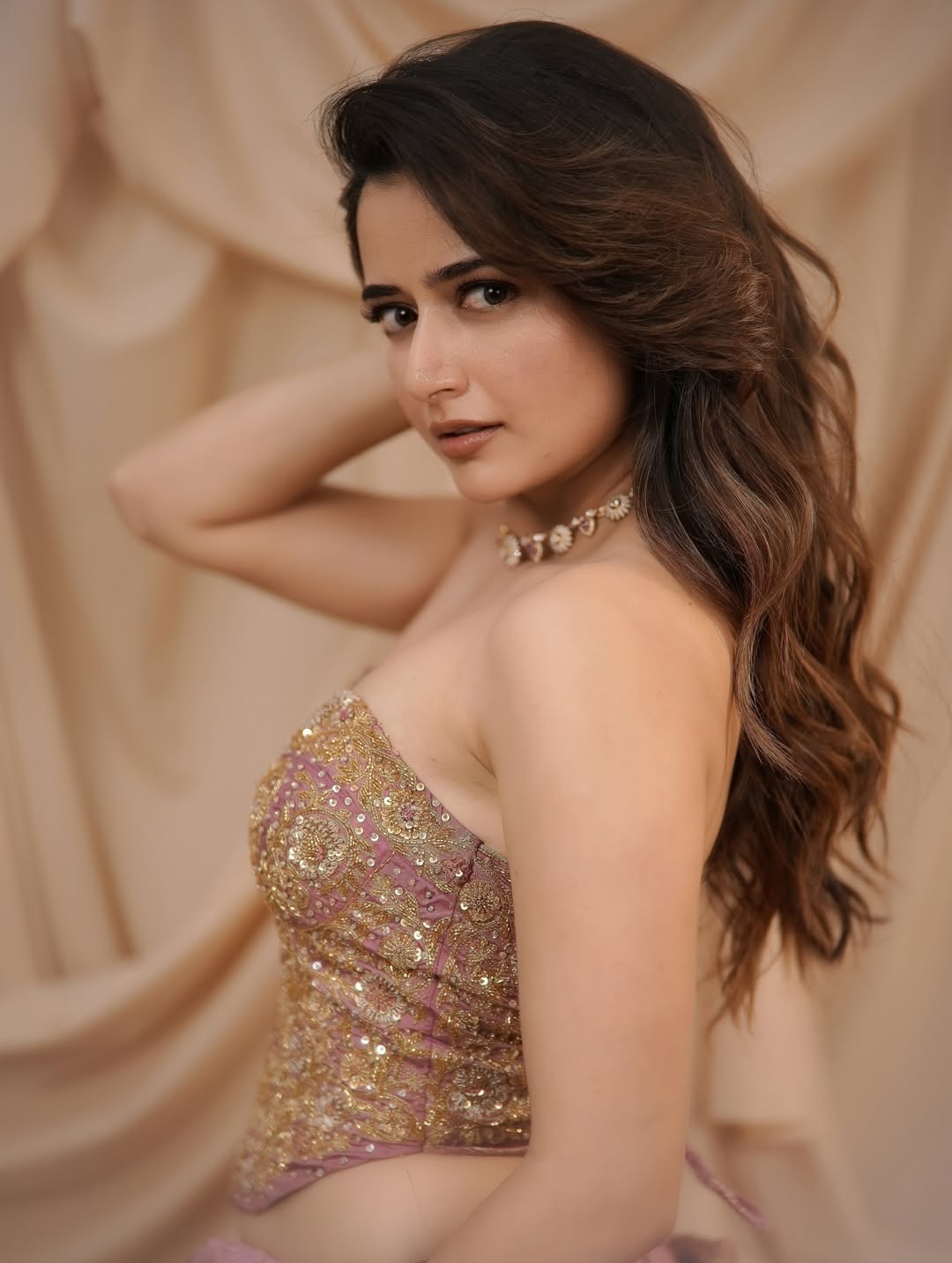 Ashika Ranganath Running Hand Near Her Hair Styling