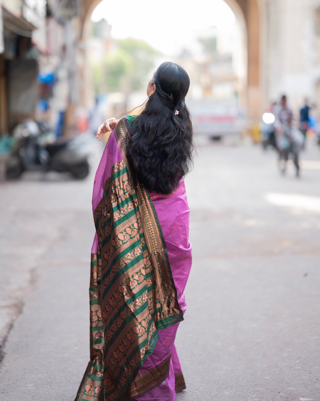 Elegant K Sudha Sitting On Street Side Ledge