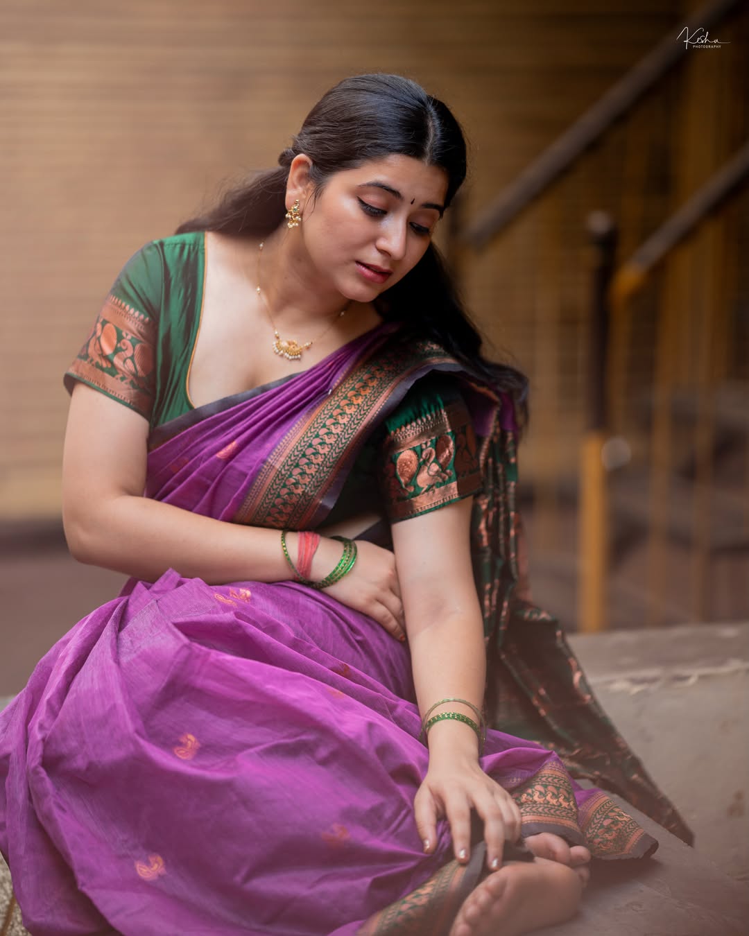 Radiant K Sudha Posing In Green Contrast Top