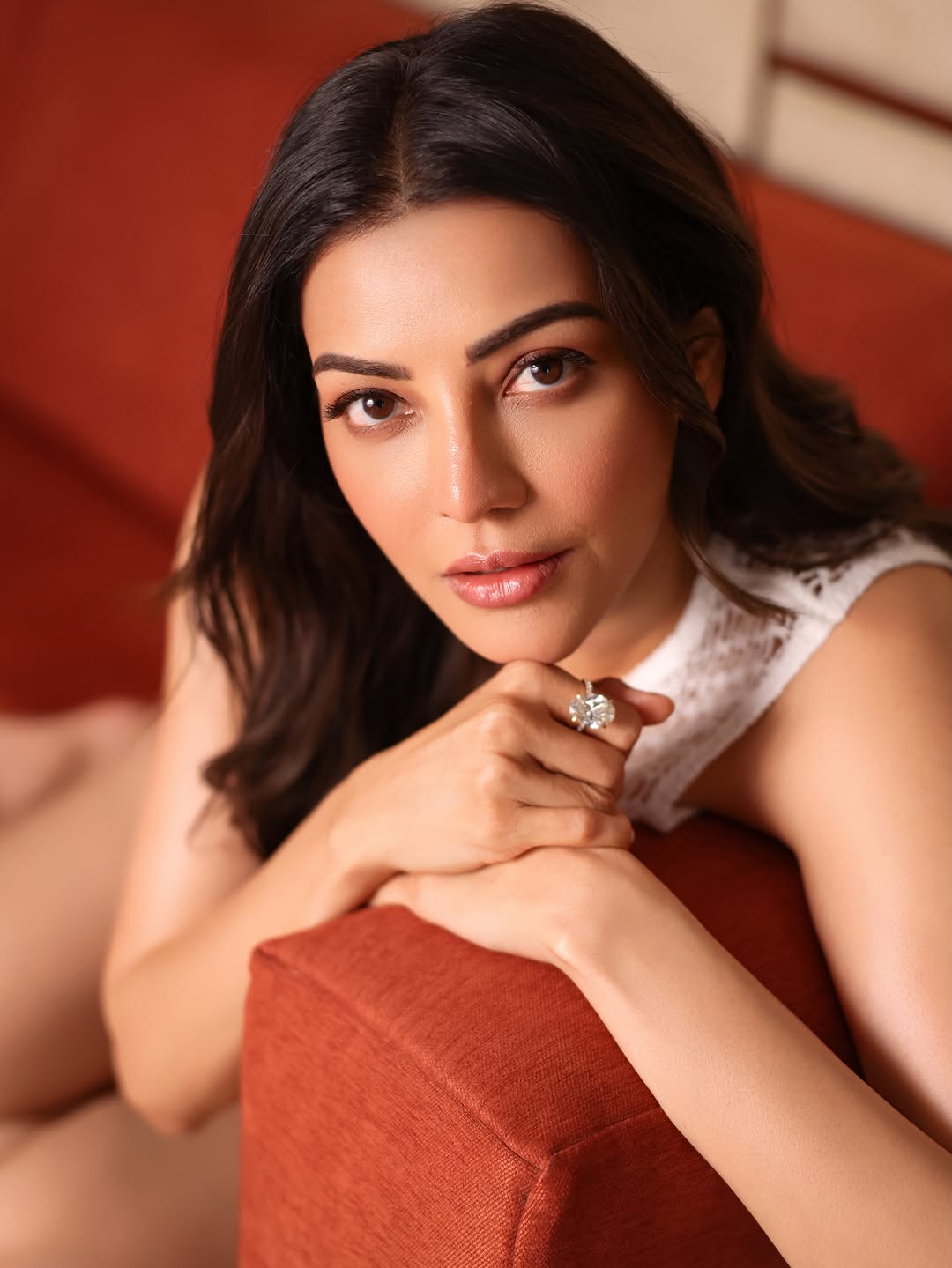 Kajal Aggarwal Resting Chin On Hands Sofa Poses