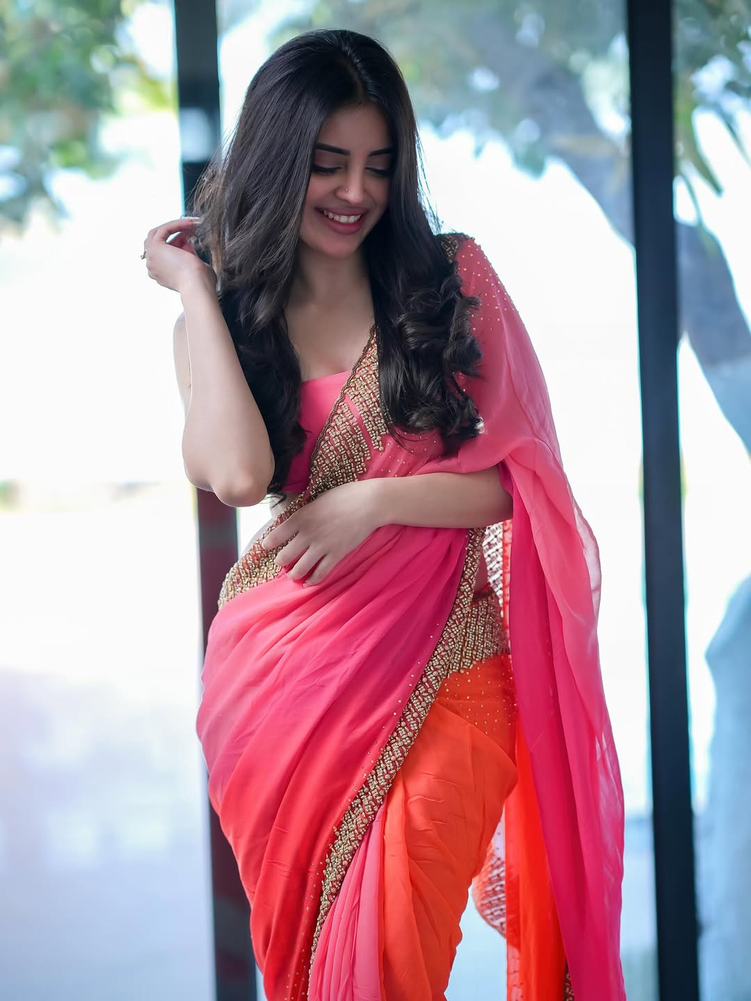 Kushitha Kallapu In Trendy Pink Orange Drape