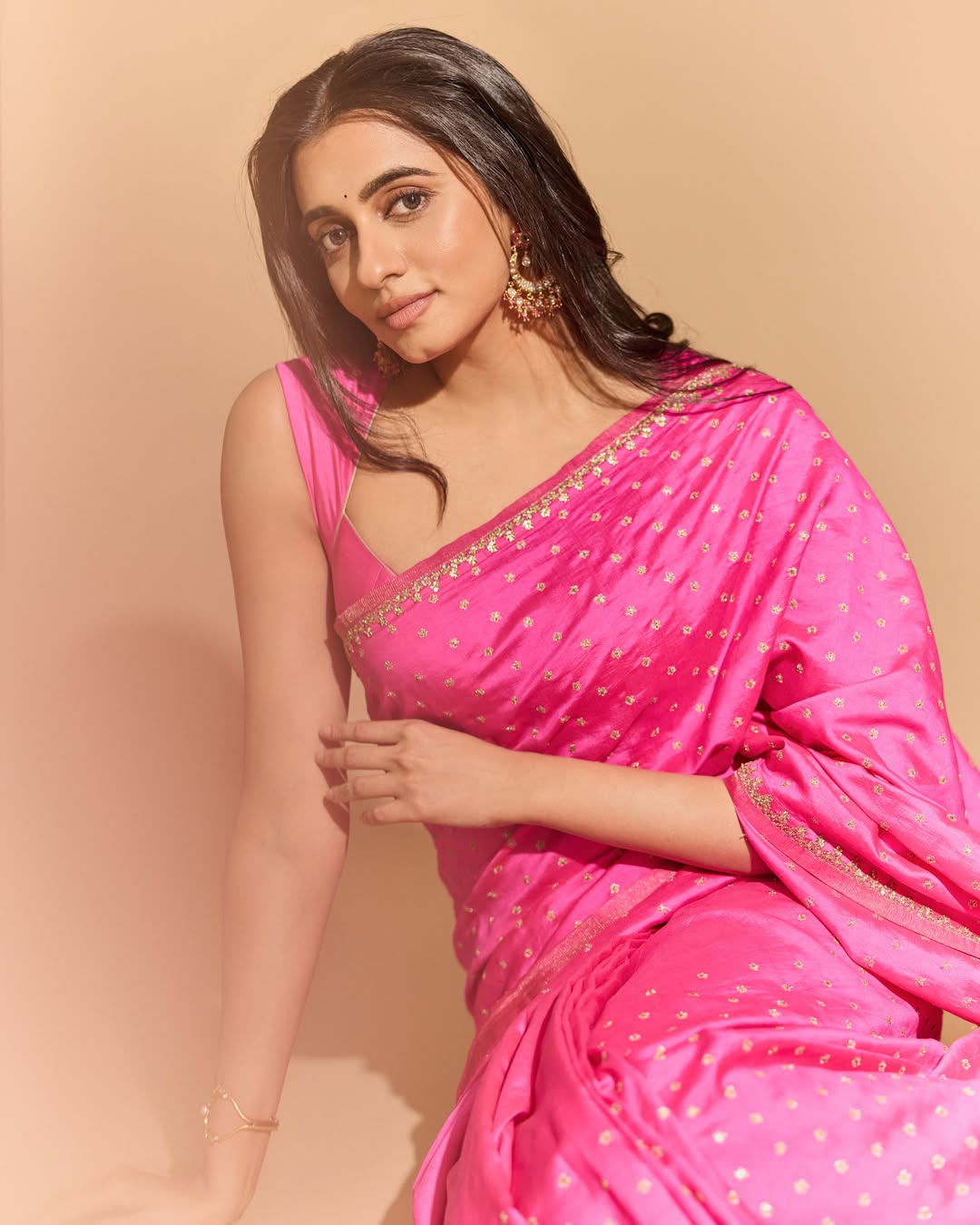 Maanasa Choudhary Sitting Gracefully In Pink Silk