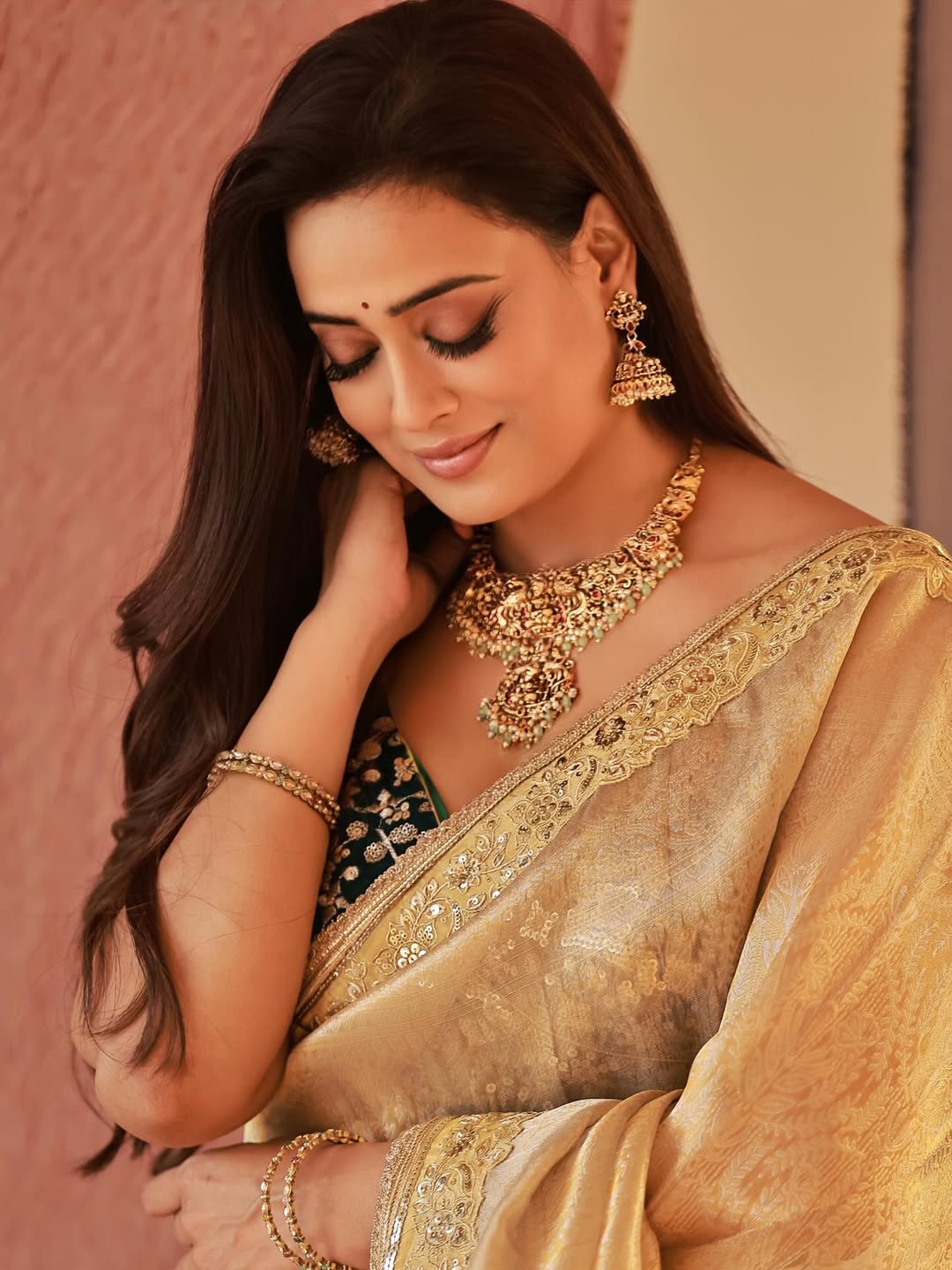 Golden Saree Look Featuring Heavy Temple Jewelry
