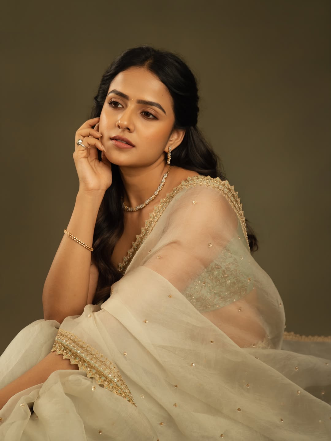 Vaishnavi Chaitanya Looking Away Hand On Cheek Pic
