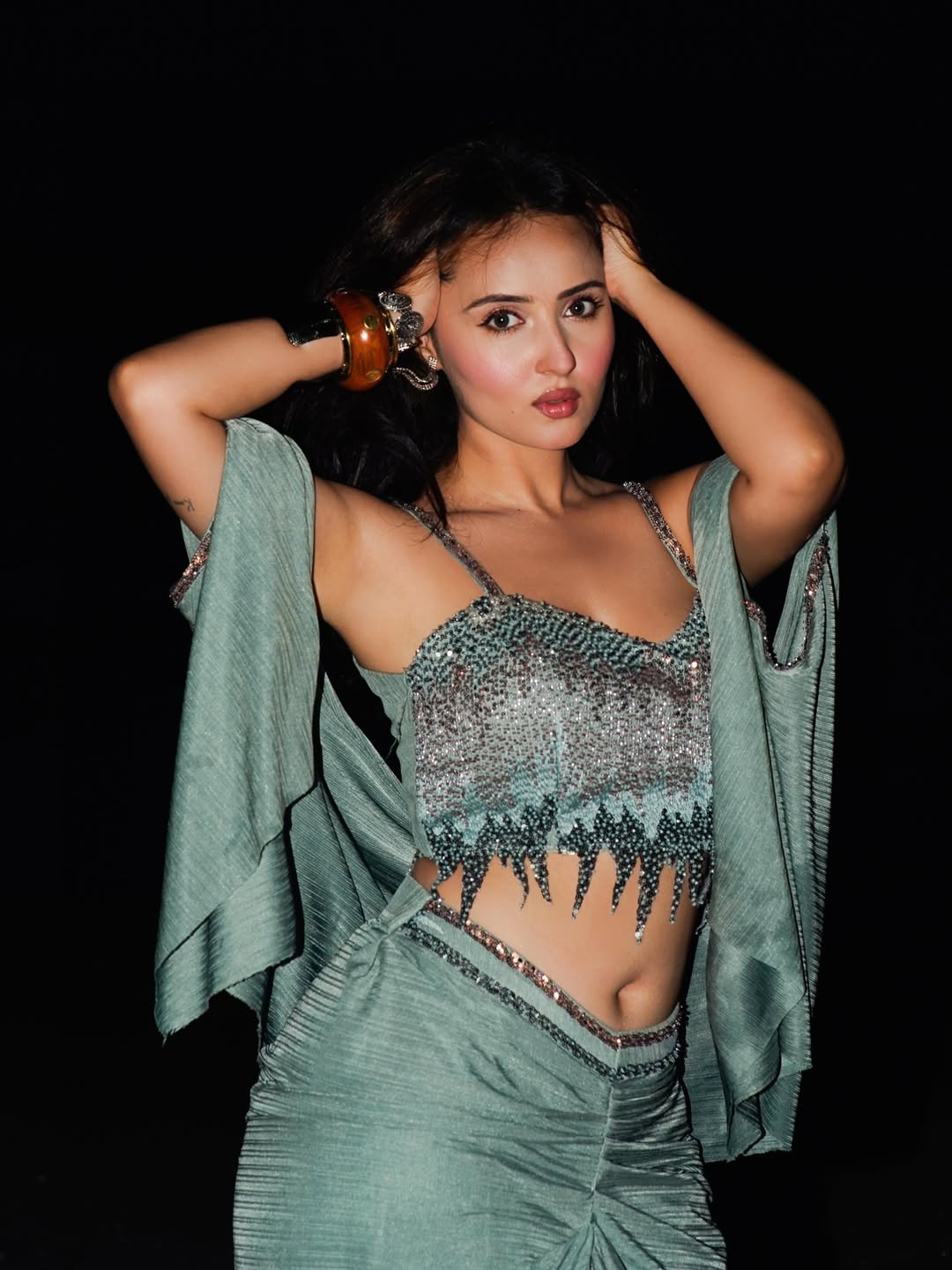Varsha Rekhate Poses In Shimmering Crop Blouse