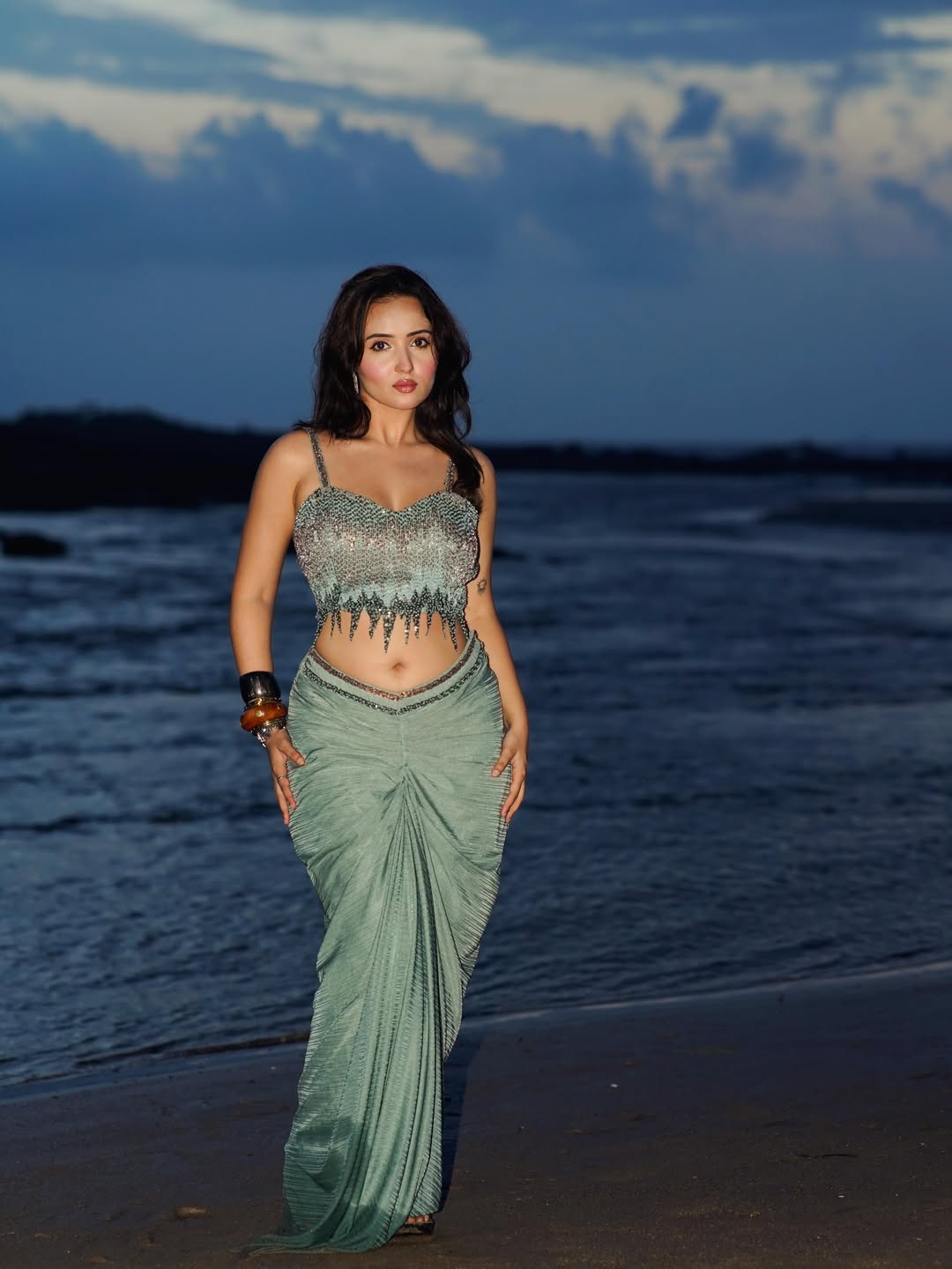 Varsha Rekhate Standing Profile View Near Water