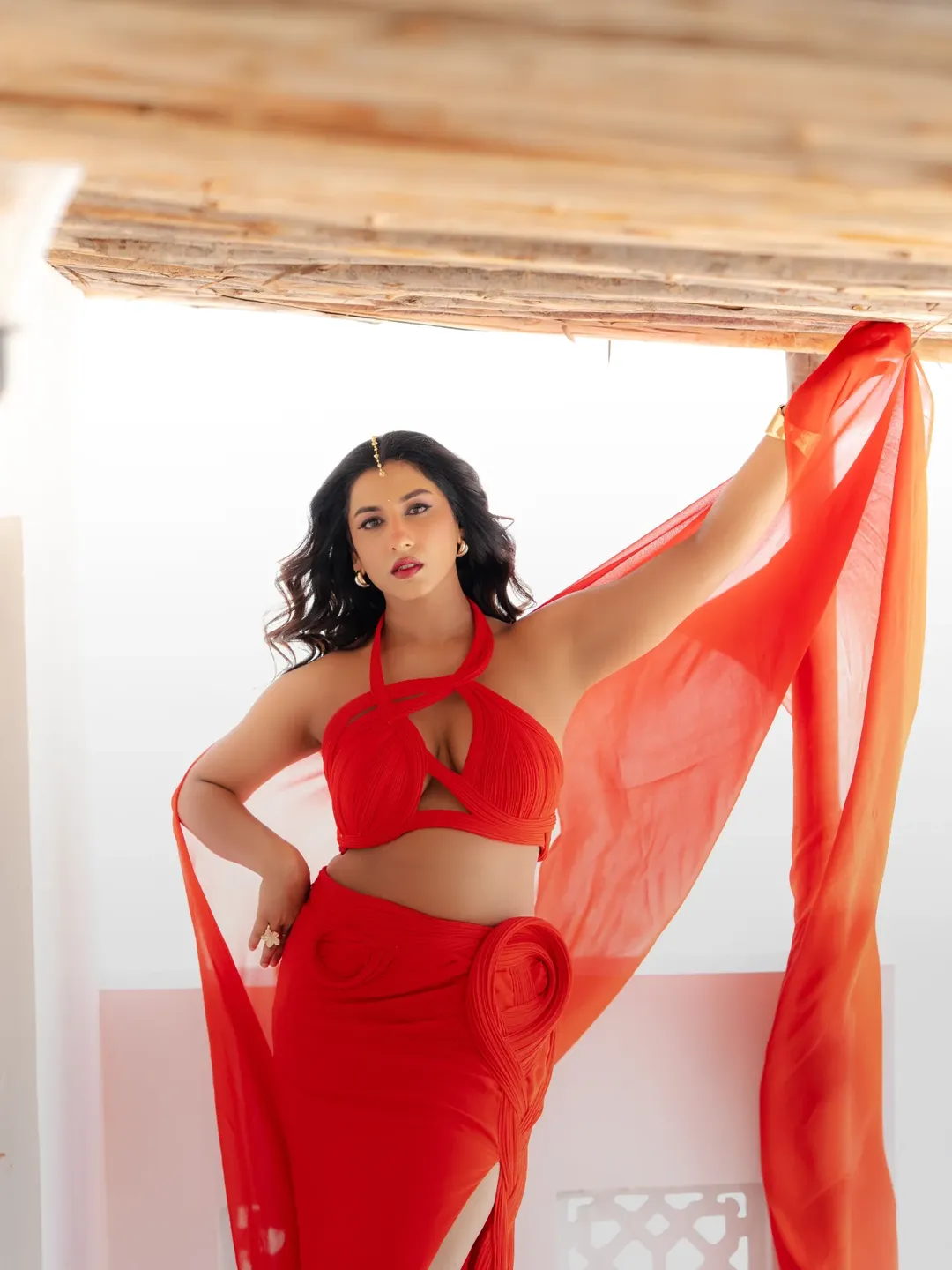 Vishnu Priya Posing Boldly In Red Halter Top