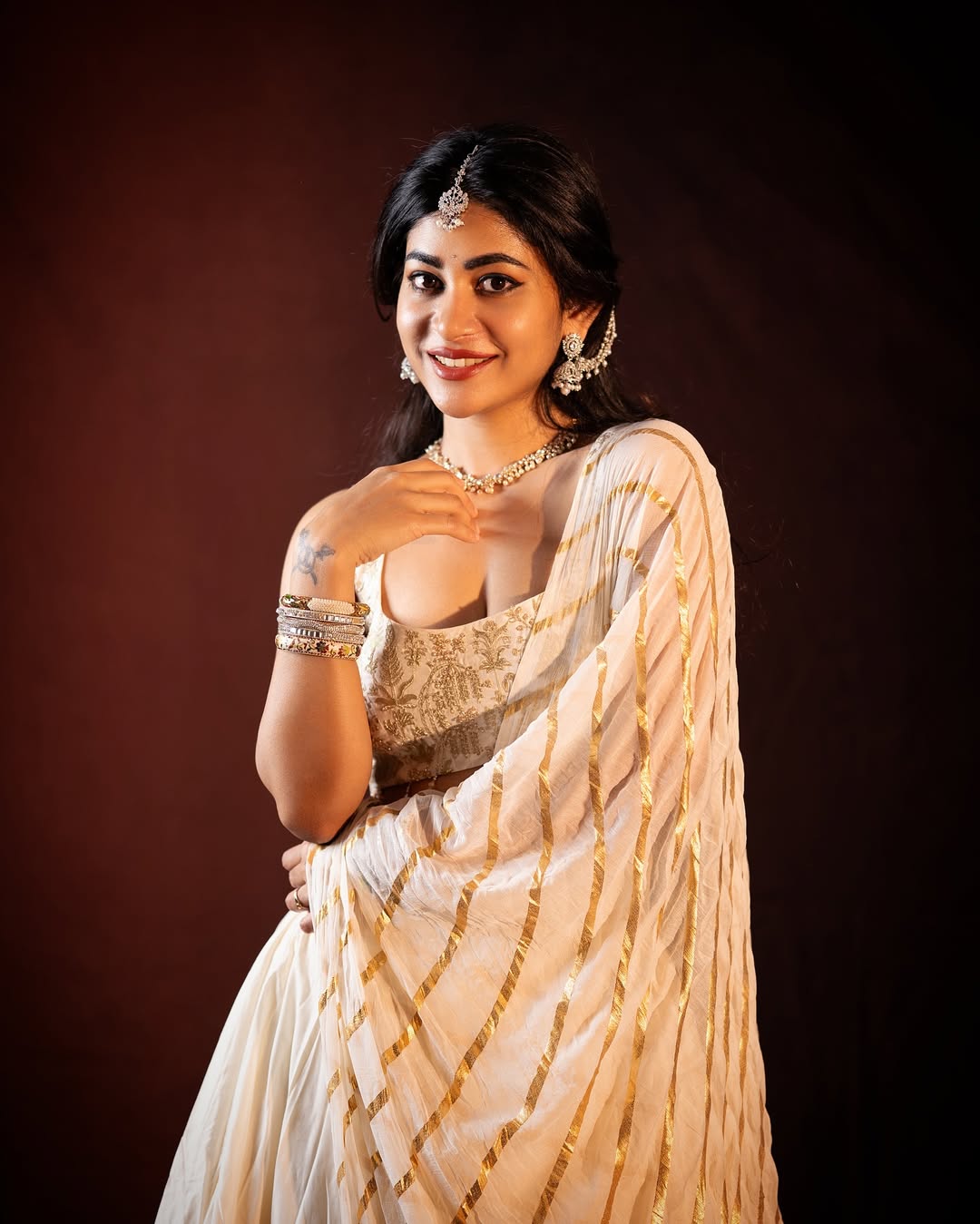 Adhya Thakur Poses Gracefully In Ivory Lehenga