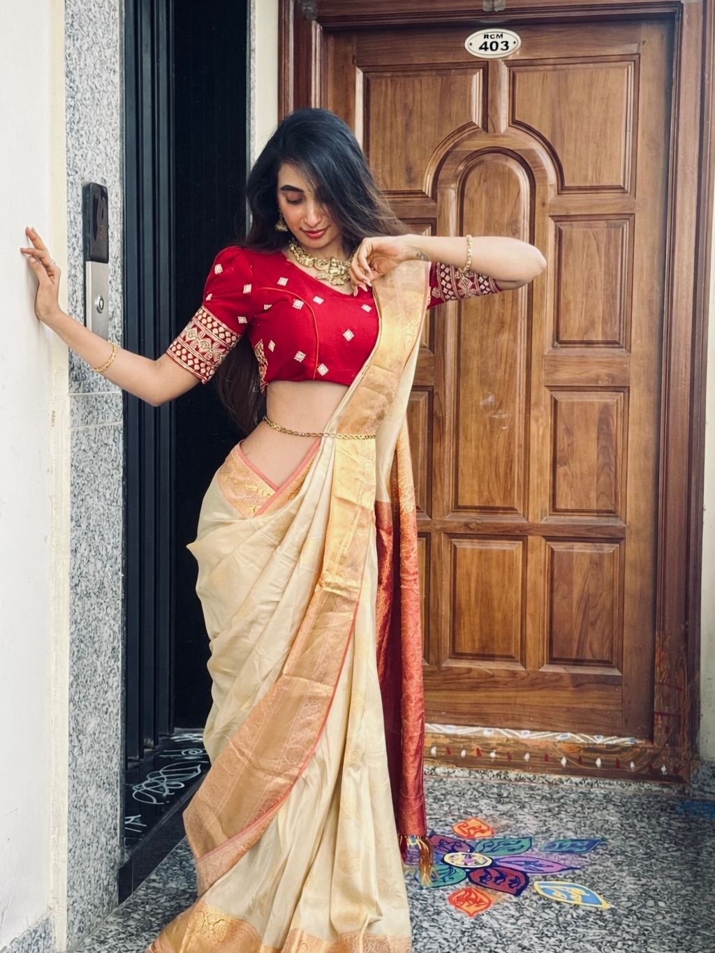 Aparna Reddy Looking Down To Adjust Pleats