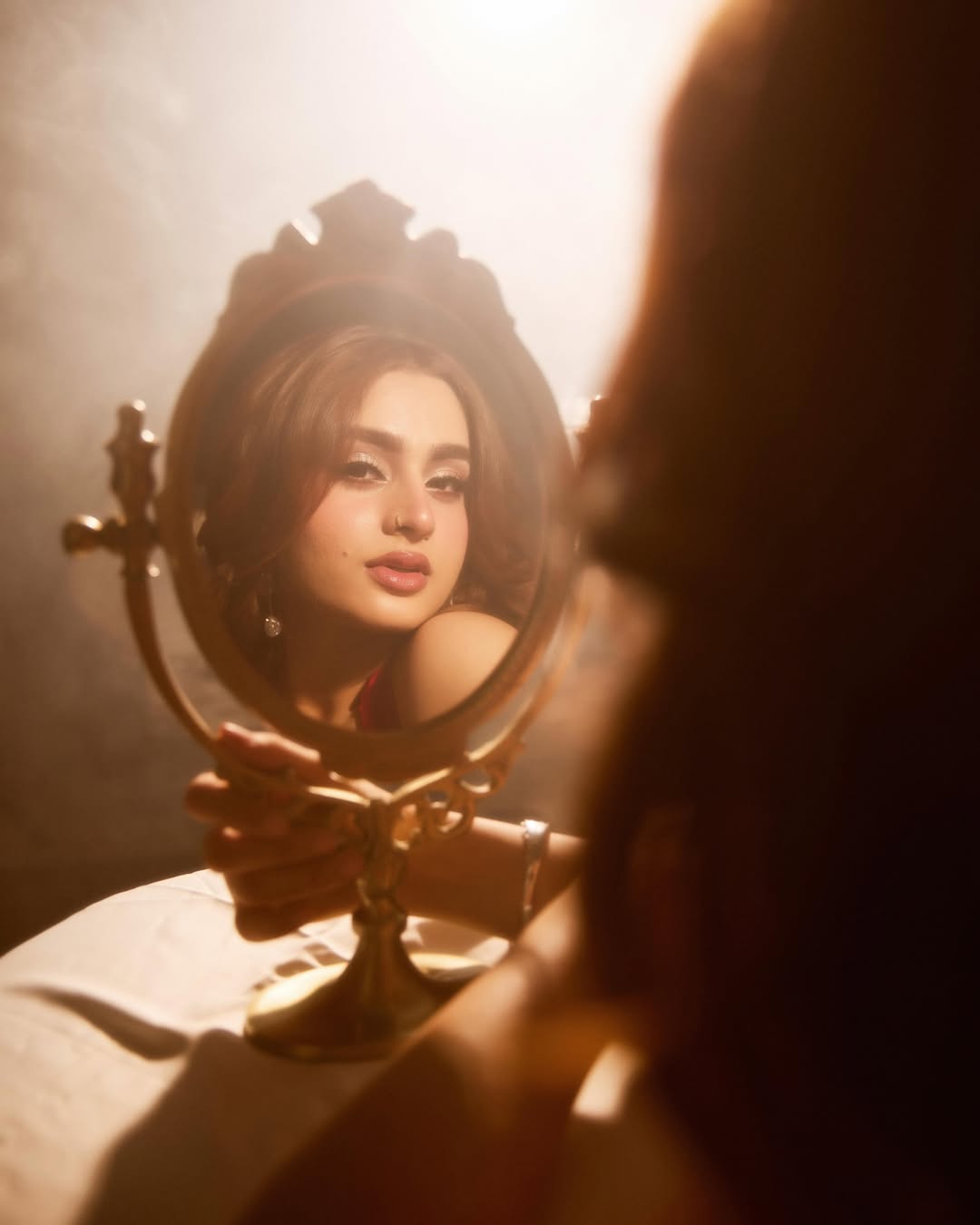 Ayesha Khan Admiring Her Reflection In Gold Mirror