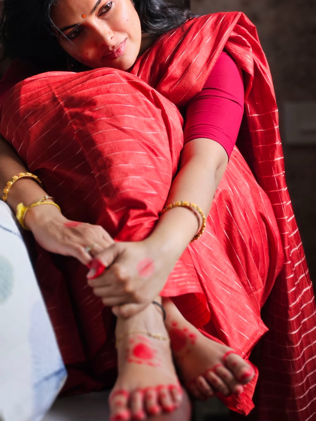 Divi Vadthya Elegant Red Feet Alta Detail