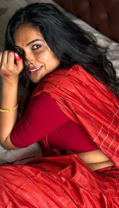 Divi Vadthya Red Alta Stained Fingers Detail