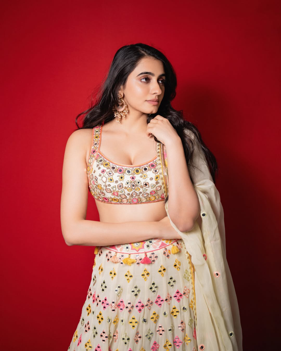 Manasa Choudhary Floor Sitting Blue Couch Stance