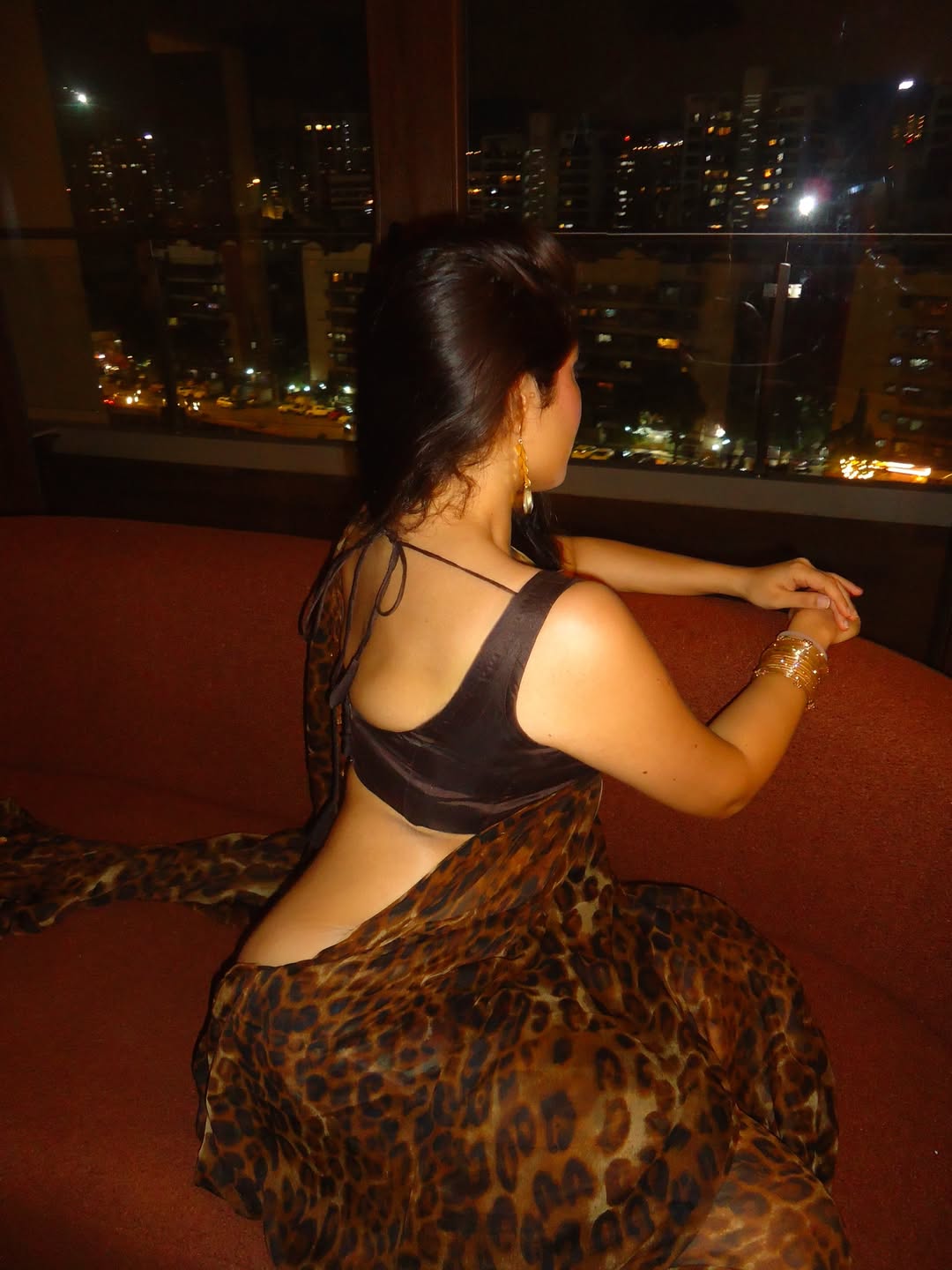 Nikita Sharma Admiring Glittering City Skyline