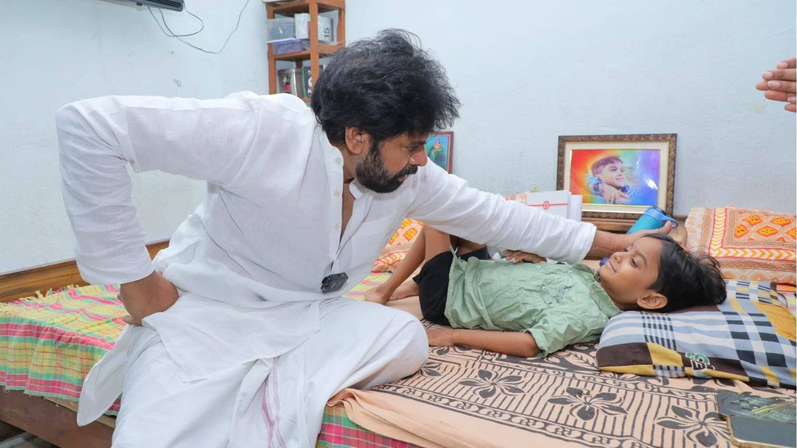 Pawan Kalyan meets young fan Niranjan during his Hanamkonda visit.