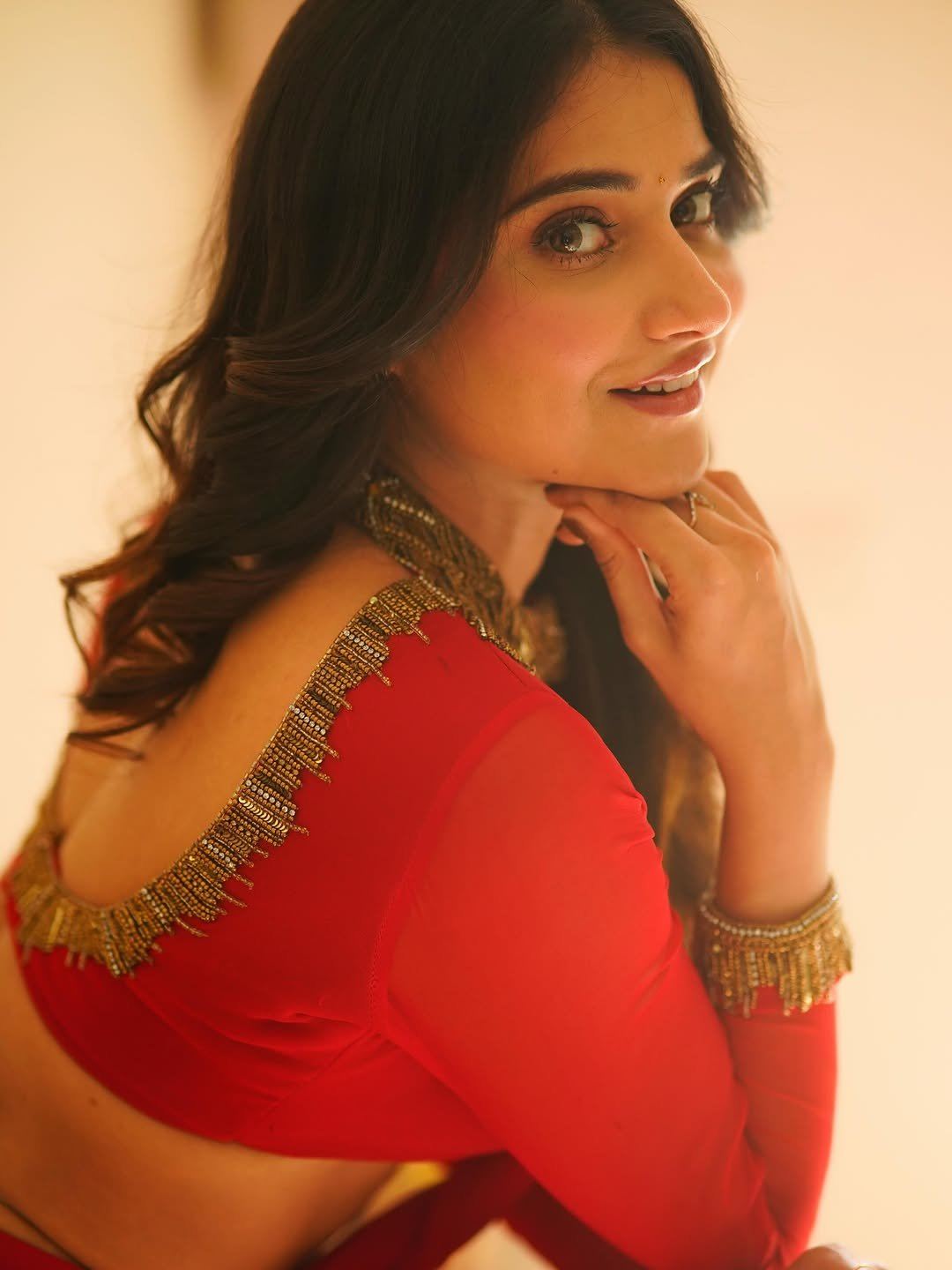 Prisha Singh In Red Saree Elegant Hand Chin Pose