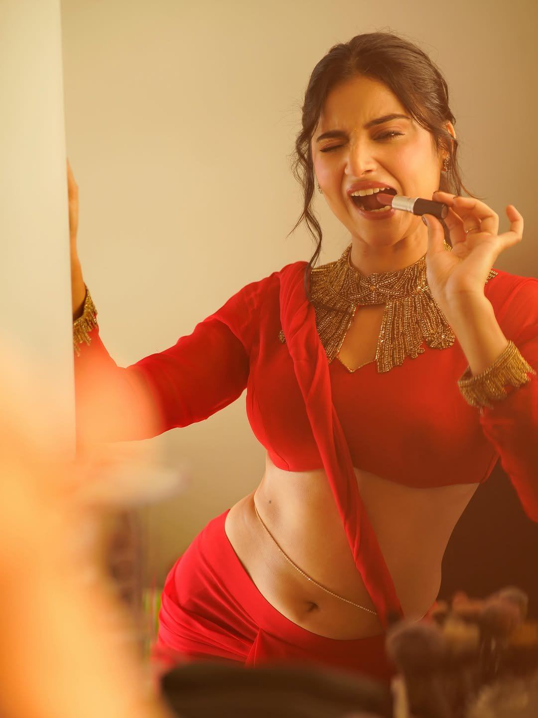 Prisha Singh In Red Saree Playful Lipstick Shot
