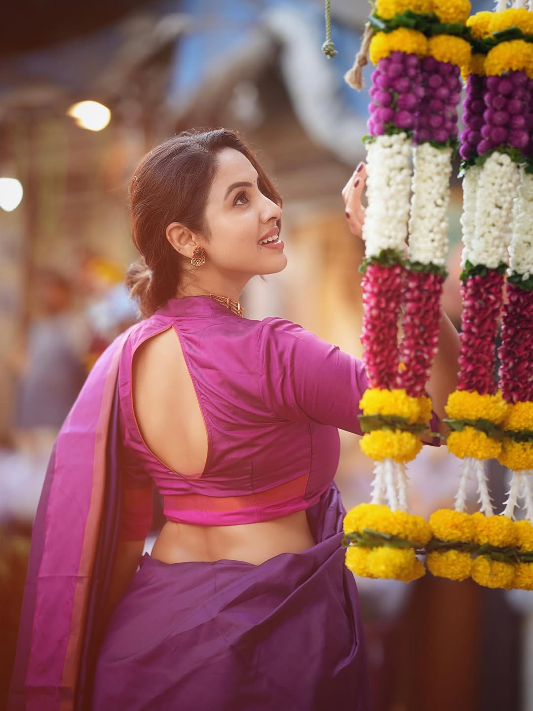 Priyanka Kholgade Looking Up At Floral Garlands