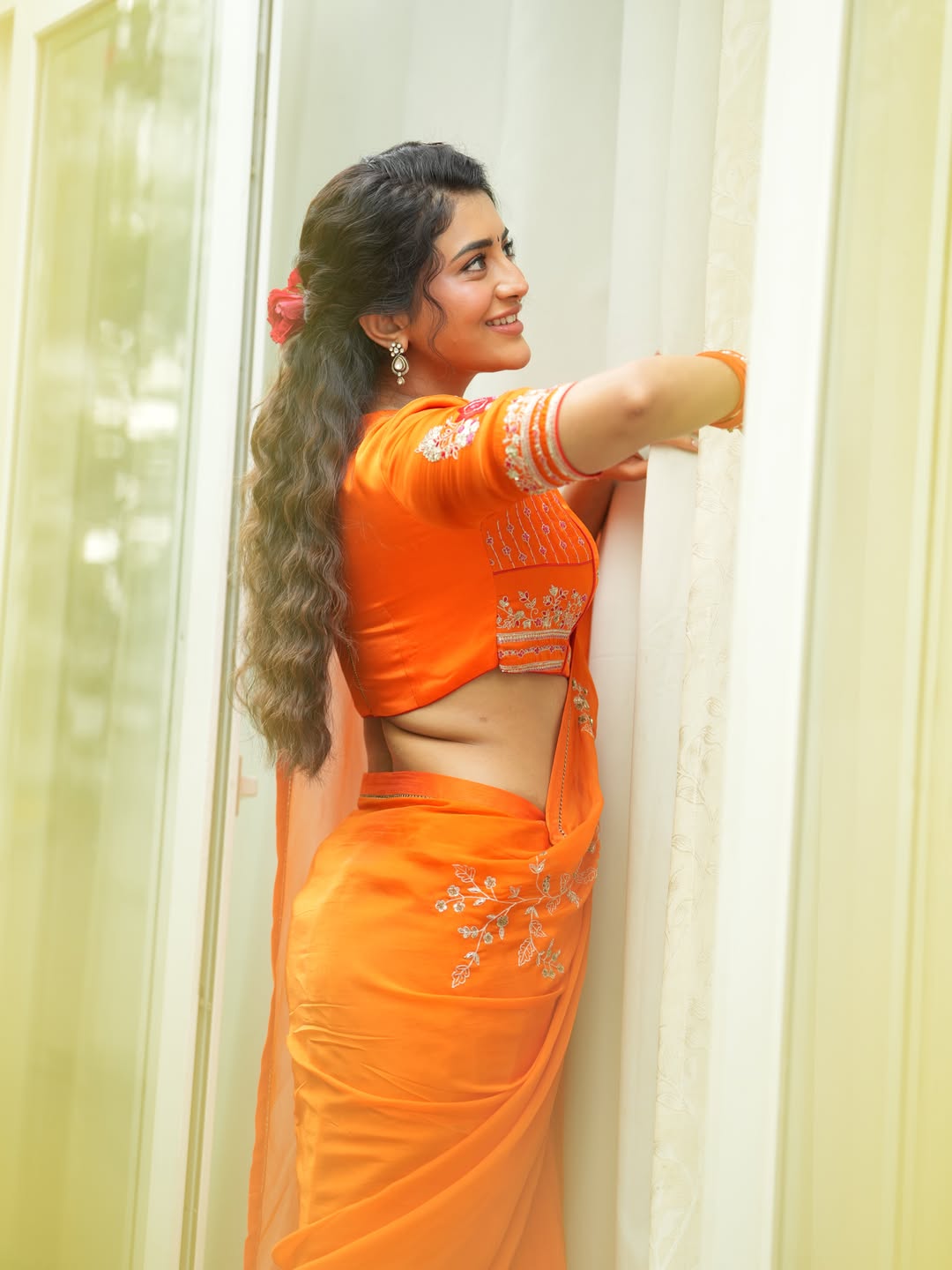 Rashi Singh Side Profile Pose In Orange Outfit