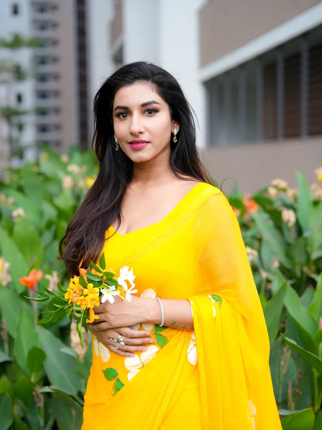 Beautiful Vishnu Priya Holding Flowers In Saree