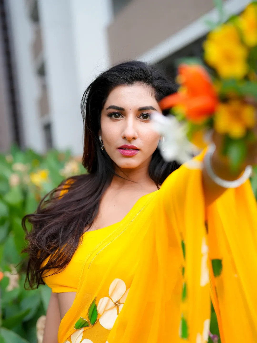 Vishnu Priya Shows Flowers In Yellow Saree Outfit