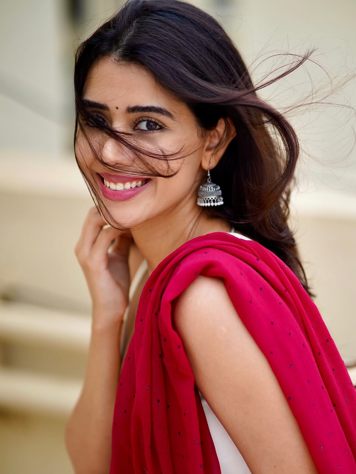 Aarti Chikara Posing Confidently In Red Saree