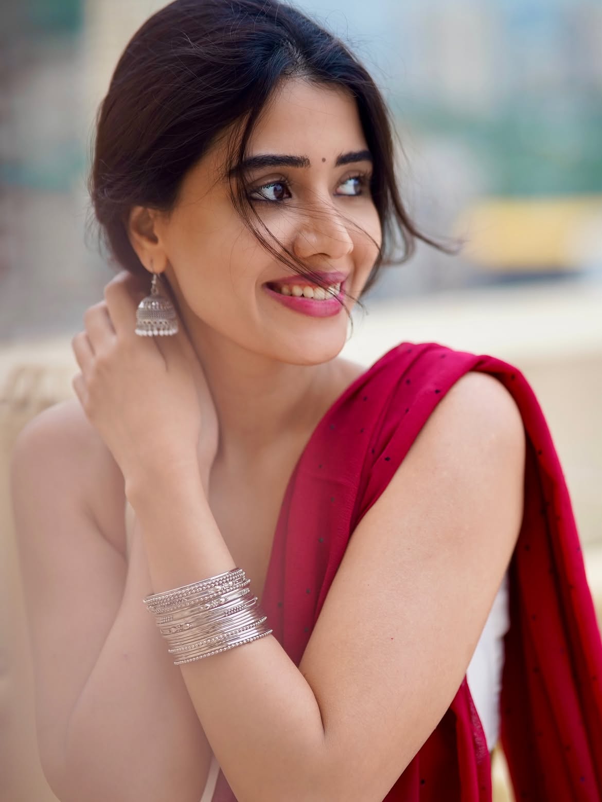 Aarti Chikara Showing Silver Jhumkas Close Up